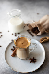 Dalgona coffee. Iced fluffy creamy whipped trend drink with coffee foam and milk. Trendy drink during Covid-19 city lock down and self quarantine, stay at home concept.