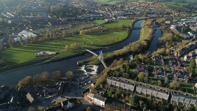 Prominent view of Millars bridge over the river Exe, view of the Exwick estate, playing fields and allotments in the background