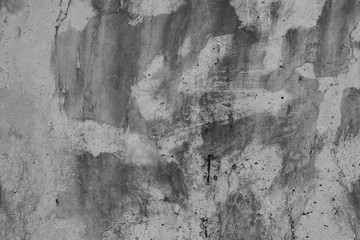 White concrete wall with black stains as background