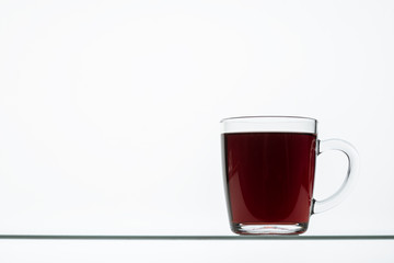 beets and beetroot juice on a glass table on a white background