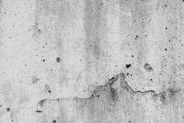 White concrete wall with black stains as background