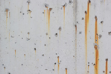 White concrete walls with rust stains as the background
