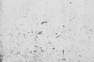 White concrete wall with black stains as background
