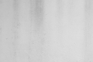 Obraz premium White concrete wall with black stains as background