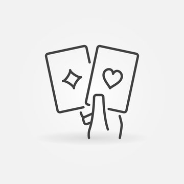 Pair of Playing Cards in Hand vector concept line icon or logo element