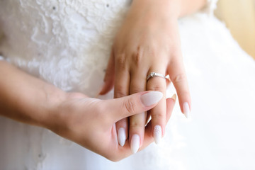 Beautiful engagement ring on a lady's hand .