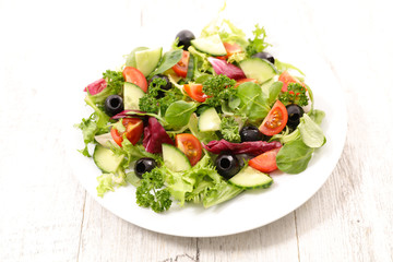 Fototapeta na wymiar vegetable salad with cucumber, tomato and olive