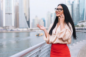 Businesswoman talking on her mobile smart phone.