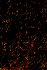 flame of fire with sparks on a black background