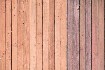 Wooden boards on an old red fence as an abstract background.