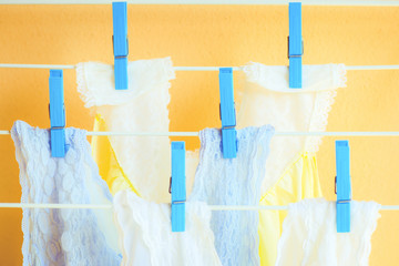 Clean clothes hanging on clothes drying rack clothesline Fresh and clean concept Homework concept