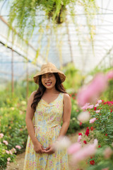 Asian girl in rose garden at the north of Thailand Chiangmai