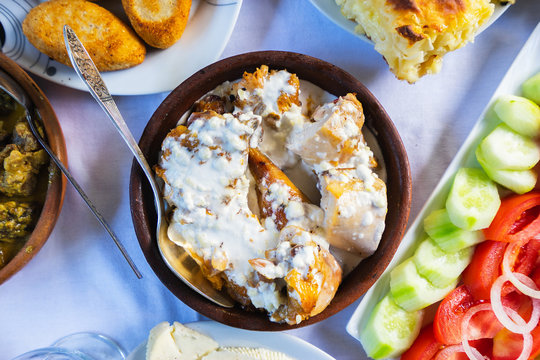Georgian dish chkmeruli with chicken. Close-up shot, selective focus.