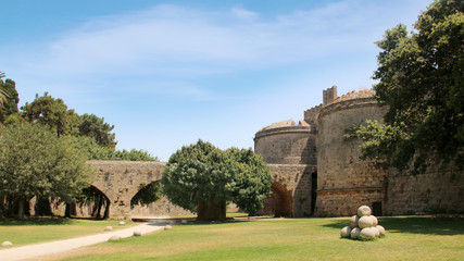 Fototapeta na wymiar Gate D`Amboise and the bastions with the bridge, fortifications of Rhodes, Rhodes Fortress, Old Town of Rhodes, Greece 