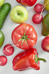 Different vegetables and fruit isolated on white background.