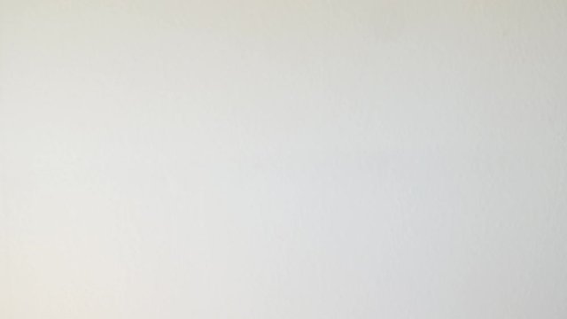 Putting leather wallet in jeans pocket and walking away.