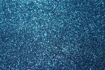 blue Sparkling Lights Festive background with texture. Abstract Christmas twinkled bright bokeh defocused and Falling stars. Winter Card or invitation	