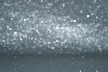 Silver Sparkling Lights Festive background with texture. Abstract Christmas twinkled bright bokeh defocused and Falling stars. Winter Card or invitation	