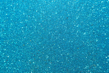 blue Sparkling Lights Festive background with texture. Abstract Christmas twinkled bright bokeh defocused and Falling stars. Winter Card or invitation	