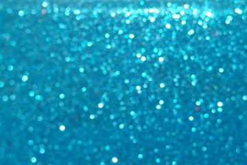 blue Sparkling Lights Festive background with texture. Abstract Christmas twinkled bright bokeh defocused and Falling stars. Winter Card or invitation	