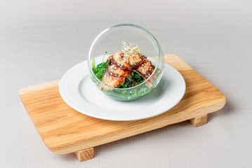 salad with eel and wakame in a flask