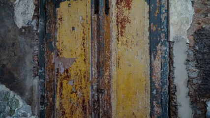 Iron fence ornaments and wooden doors in ancient Roman style buildings.