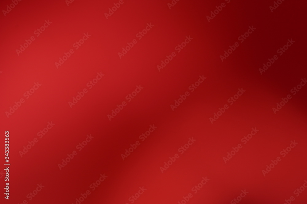 Wall mural red background abstract pattern texture defocused and falling stars. winter card or invitation