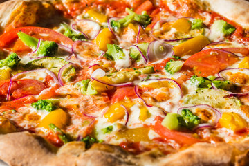 Hot fresh vegetarian pizza on the table. Italian cuisine and dishes concept.