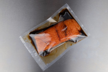 vacuum-packed marinated salmon closeup