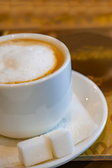 mug from a cappuccino on a wooden table