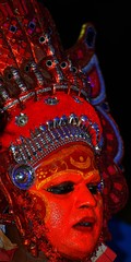 Fototapeta premium These are typical Theyyam artists dressed up during an annual Thira festival in north Malabar region in the state of Kerala in India.
