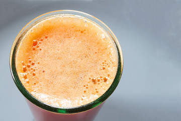 Fresh fruit smoothies are a component of a healthy diet. Tropical fruit drink on the table in a glass for diet and vegetarian concept