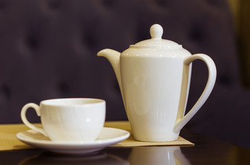 Tea cup and tea pot on table. Breakfast and Five O'Clock Tea. Tea time.