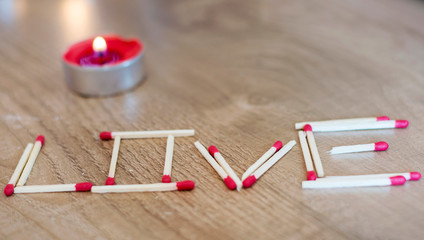 Love Word Written with Matches .Saint Valentines Background 