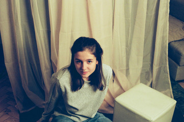 A beautiful young woman looks seriously