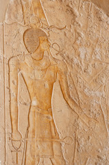 Hieroglyphic carvings on an ancient egyptian temple wall
