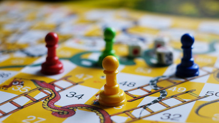 Close-up of snakes and ladders game children playground.
