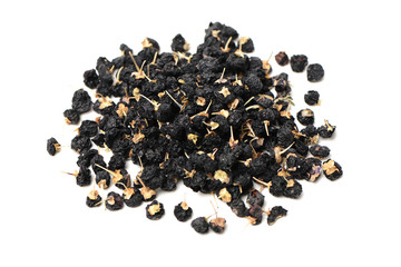 Traditional Chinese black herbs dried wolfberry on white background