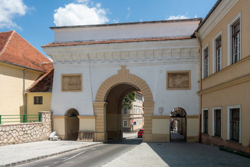 Obraz premium Schei gate in old city of Brasov, Transylvania, Romania; summer day