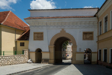 Fototapeta na wymiar Schei gate in old city of Brasov, Transylvania, Romania; summer day