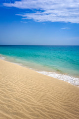 Fototapeta na wymiar Ponta preta beach and dune in Santa Maria, Sal Island, Cape Verde