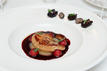 Grilled duck liver in white china plate