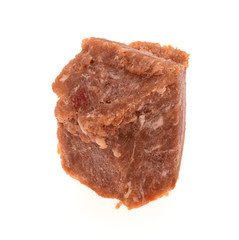 a large piece of frozen minced meat on a white background