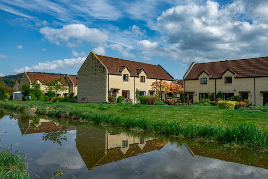 Houses on river shore in Bathampton , UK
