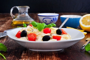 Cheese pasta with basil and olives 