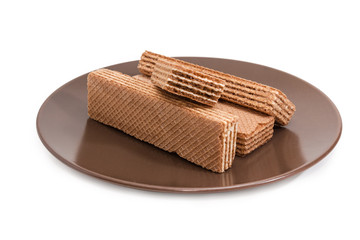Layered wafer biscuits on the brown dish