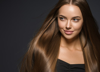 Natural beauty female face close up portrait young woman with healthy hair and tan skin