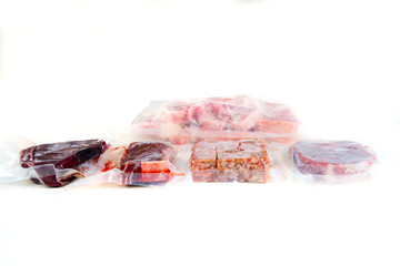 Frozen various raw meat wrapped in the plastic