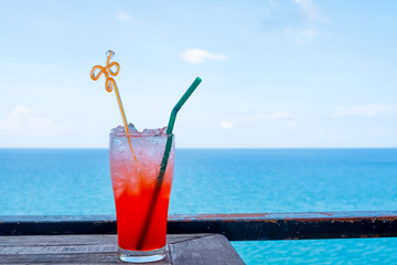 Cold punch water drink With a backdrop of beautiful sea views Suitable for drinking in a glass. Watching the view on holidays Of travel.