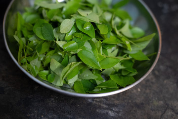 Curry leaves in a plate